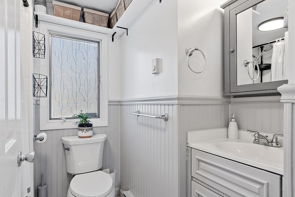 98 Boat House Road Groton, MA 01450 - Photo 24 of 39 a bathroom with a sink a toilet and a mirror