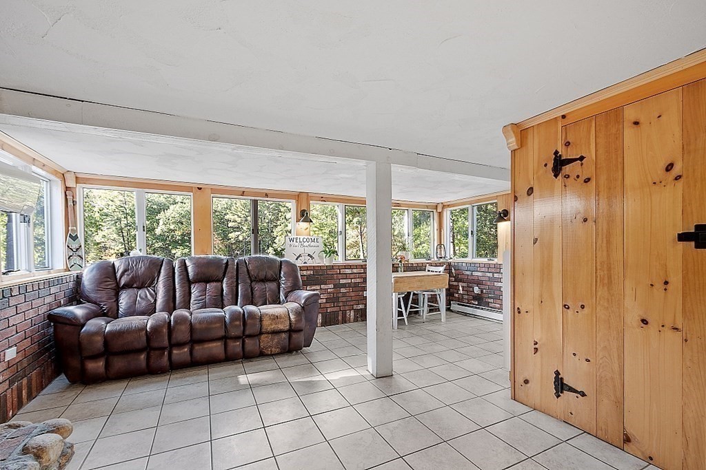 98 Boat House Road Groton, MA 01450 - Photo 33 of 39 a living room with furniture and a large window