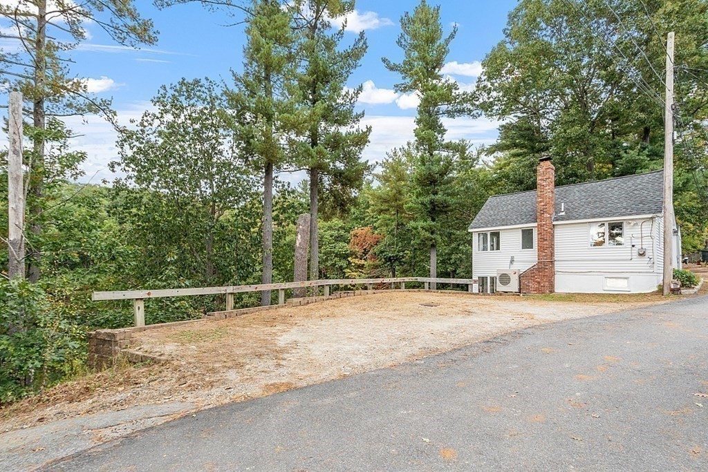 98 Boat House Road Groton, MA 01450 - Photo 38 of 39 a view of a road with a house in the background