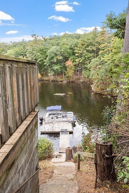 98 Boat House Road Groton, MA 01450 - Photo 5 of 39 a view of a lake with houses
