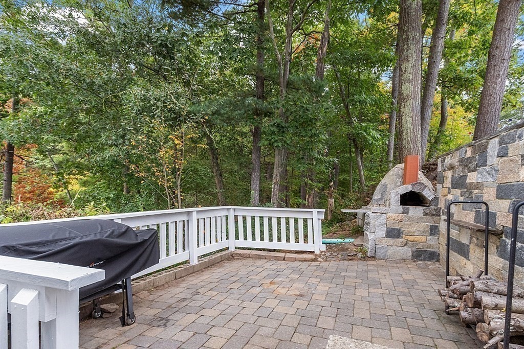 98 Boat House Road Groton, MA 01450 - Photo 6 of 39 a view of backyard with a table and chair