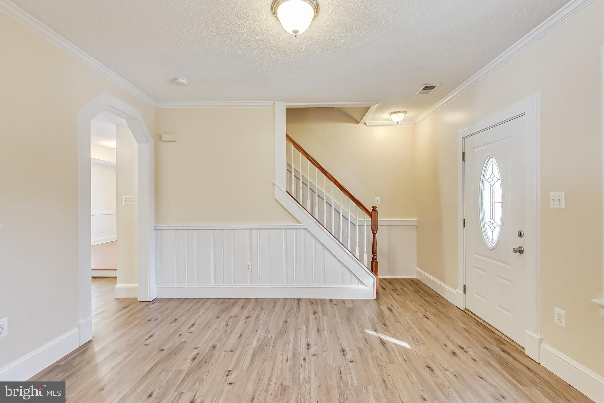 240 Norman Road Stafford, VA 22554 - Photo 17 of 46 living Area with front entrance and stairs up