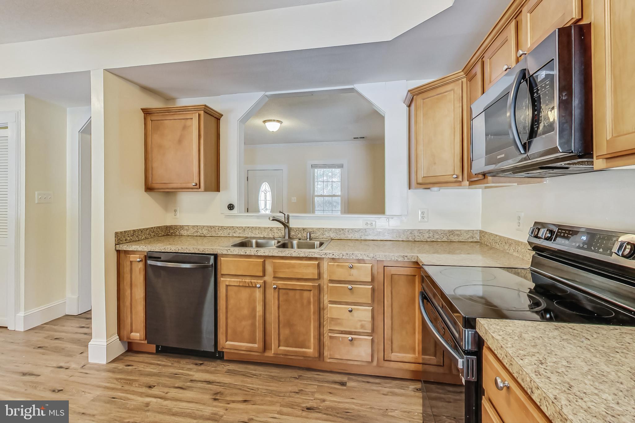 240 Norman Road Stafford, VA 22554 - Photo 6 of 46 Kitchen lower Level Peeking to the front entrance