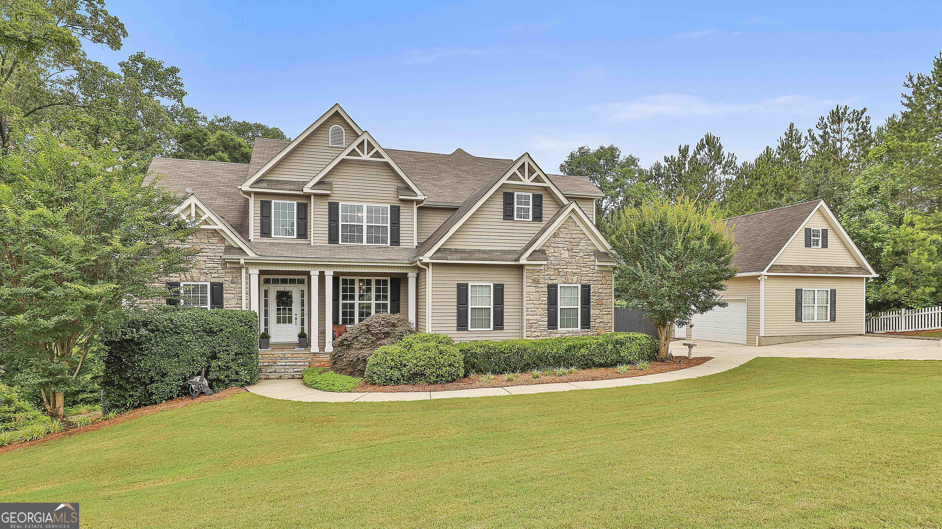 2975 Hickory Hill Road Brooks, GA 30205 - Photo 1 of 1 a front view of a house with a garden