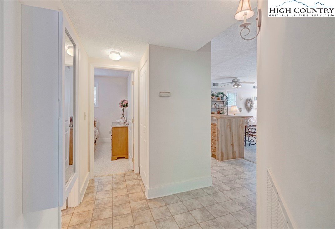 190 Still Lake Drive, Unit 321 Boone, NC 28607 - Photo 16 of 30 a view of a hallway with bathroom