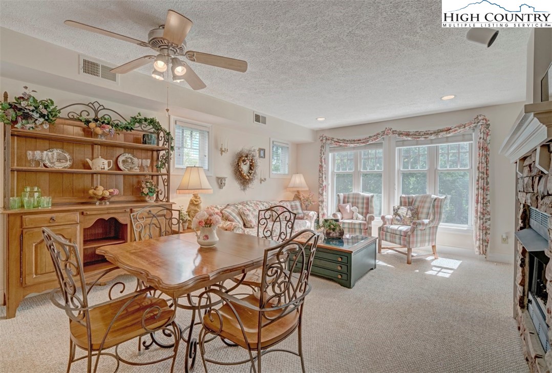 190 Still Lake Drive, Unit 321 Boone, NC 28607 - Photo 2 of 30 a view of a dining room with furniture window and outside view