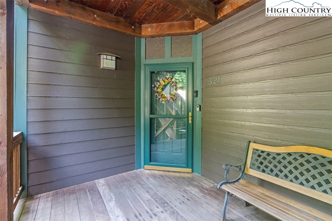 190 Still Lake Drive, Unit 321 Boone, NC 28607 - Photo 21 of 30 a view of a wooden door and wooden floor
