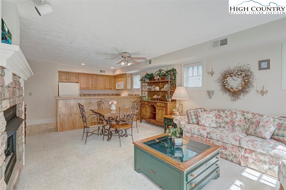 190 Still Lake Drive, Unit 321 Boone, NC 28607 - Photo 4 of 30 a living room with furniture and a table
