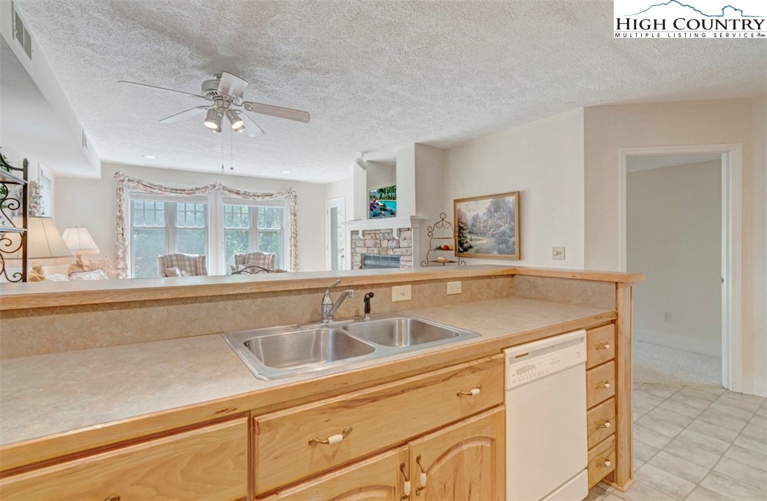 190 Still Lake Drive, Unit 321 Boone, NC 28607 - Photo 9 of 30 a view with granite countertop a sink and a window
