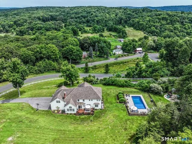 a view of a play ground with large trees