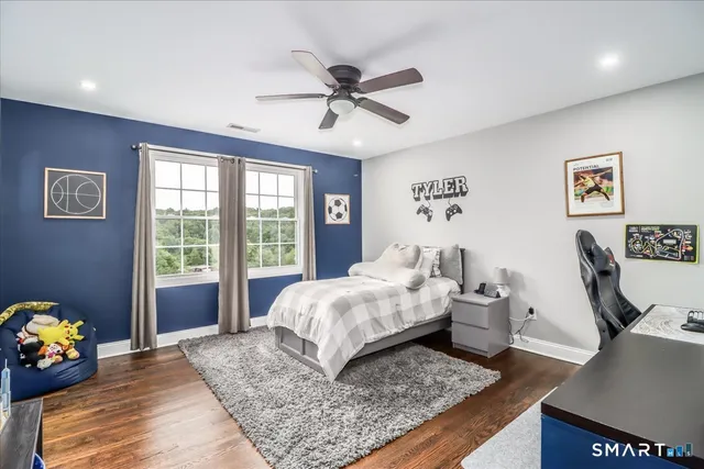 a bed room with a bed and a window