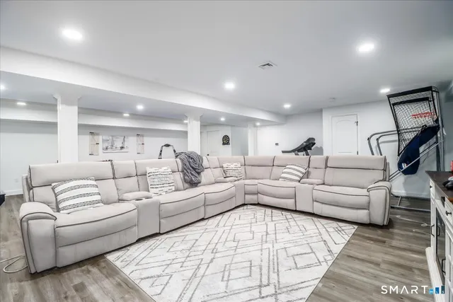 a living room with furniture and a rug