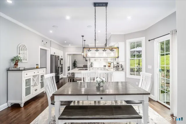 a view of kitchen with cabinets and wooden floor