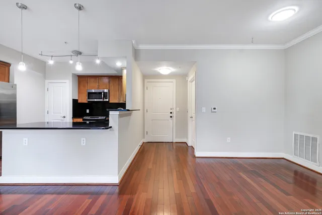 a view of a kitchen with a sink and a microwave
