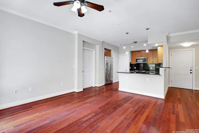 a view of a kitchen with microwave and cabinets