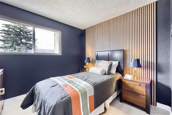 a bedroom with a bed and window