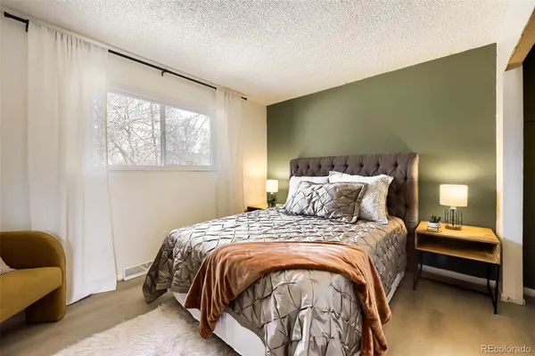 a bedroom with bed and a window