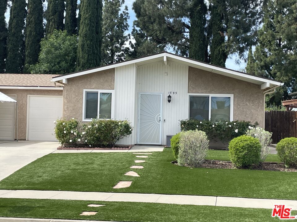 1793 Moreno Drive Simi Valley, CA 93063 - Photo 1 of 13 a front view of a house with a yard