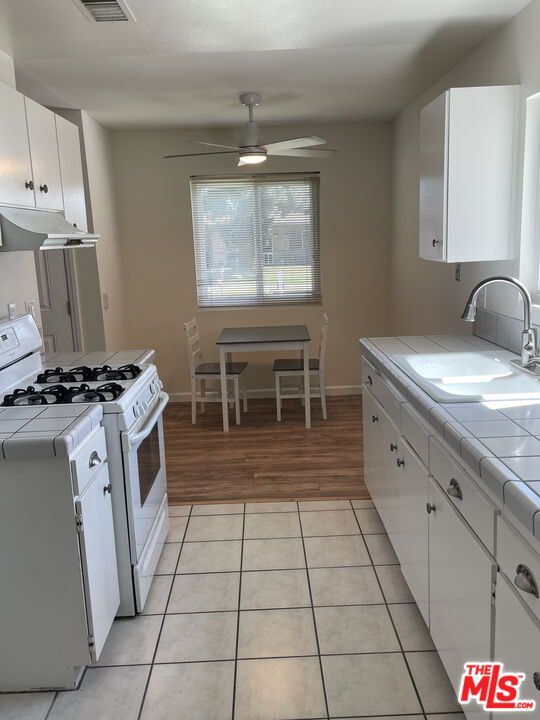 1793 Moreno Drive Simi Valley, CA 93063 - Photo 13 of 13 a kitchen with a sink and a stove top oven