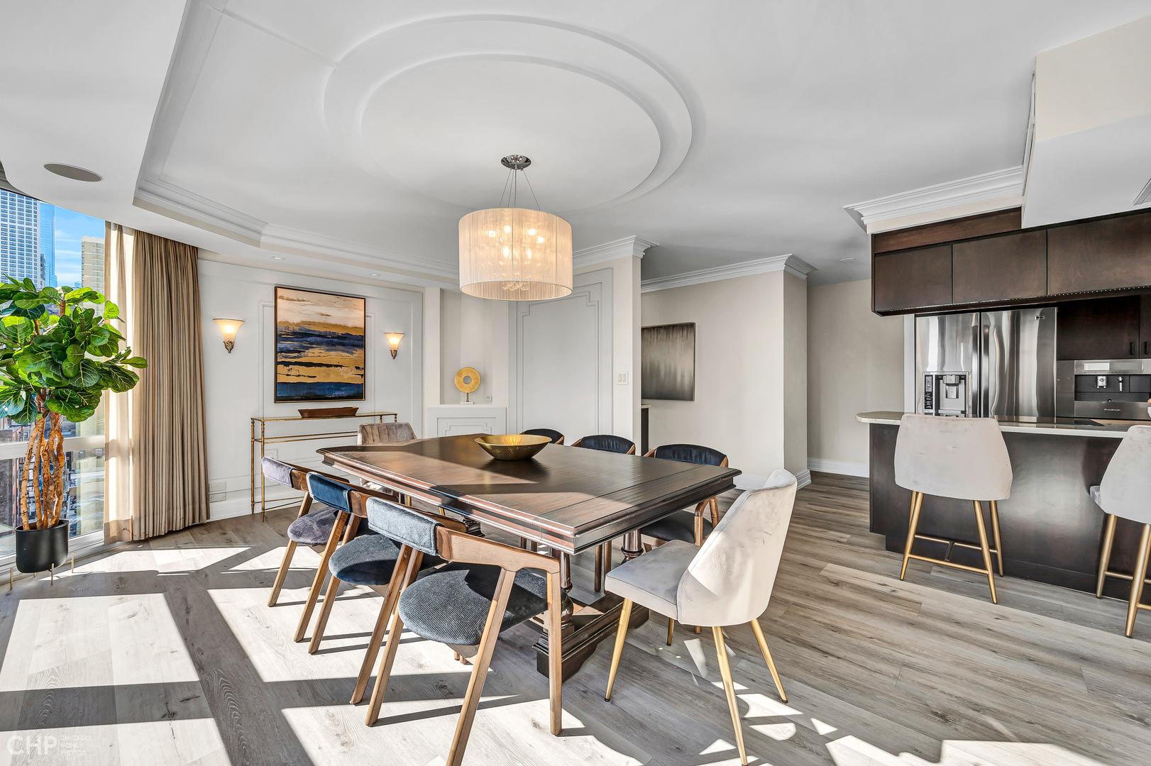 21 West Goethe Street, Unit 10G Chicago, IL 60610 - Photo 14 of 39 a view of a dining room with furniture and wooden floor