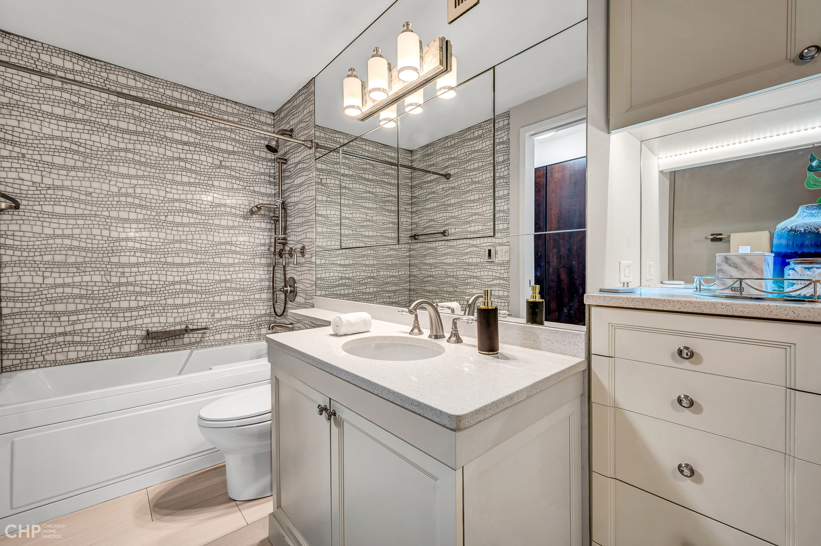 21 West Goethe Street, Unit 10G Chicago, IL 60610 - Photo 23 of 39 a bathroom with a sink a toilet and shower
