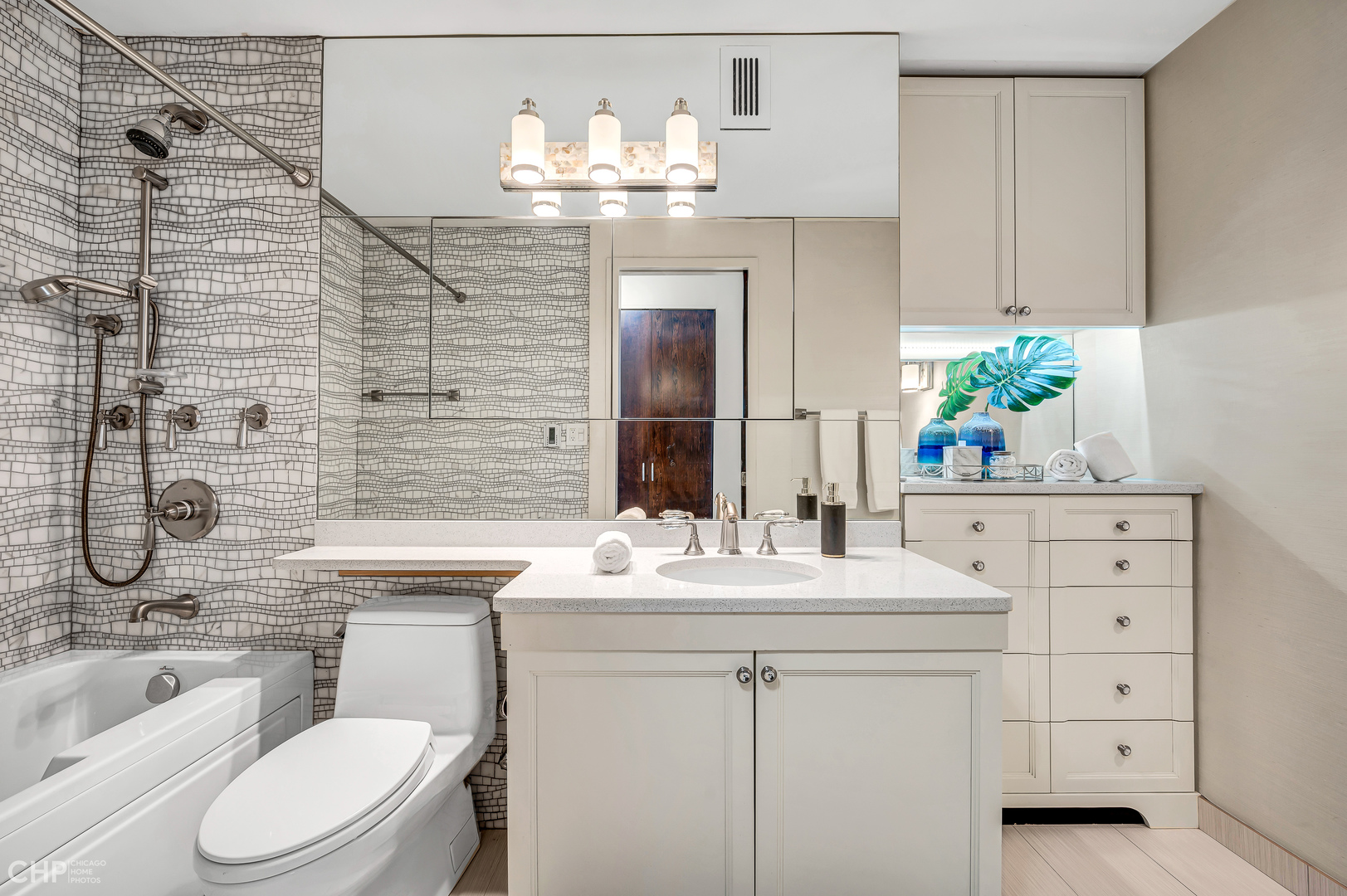 21 West Goethe Street, Unit 10G Chicago, IL 60610 - Photo 24 of 39 a bathroom with a sink vanity mirror and toilet