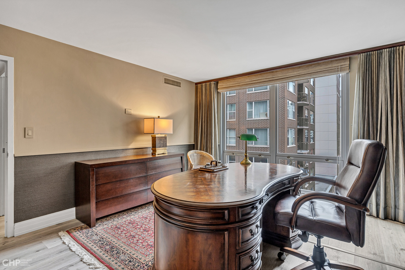 21 West Goethe Street, Unit 10G Chicago, IL 60610 - Photo 26 of 39 a dining room with furniture and a floor to ceiling window
