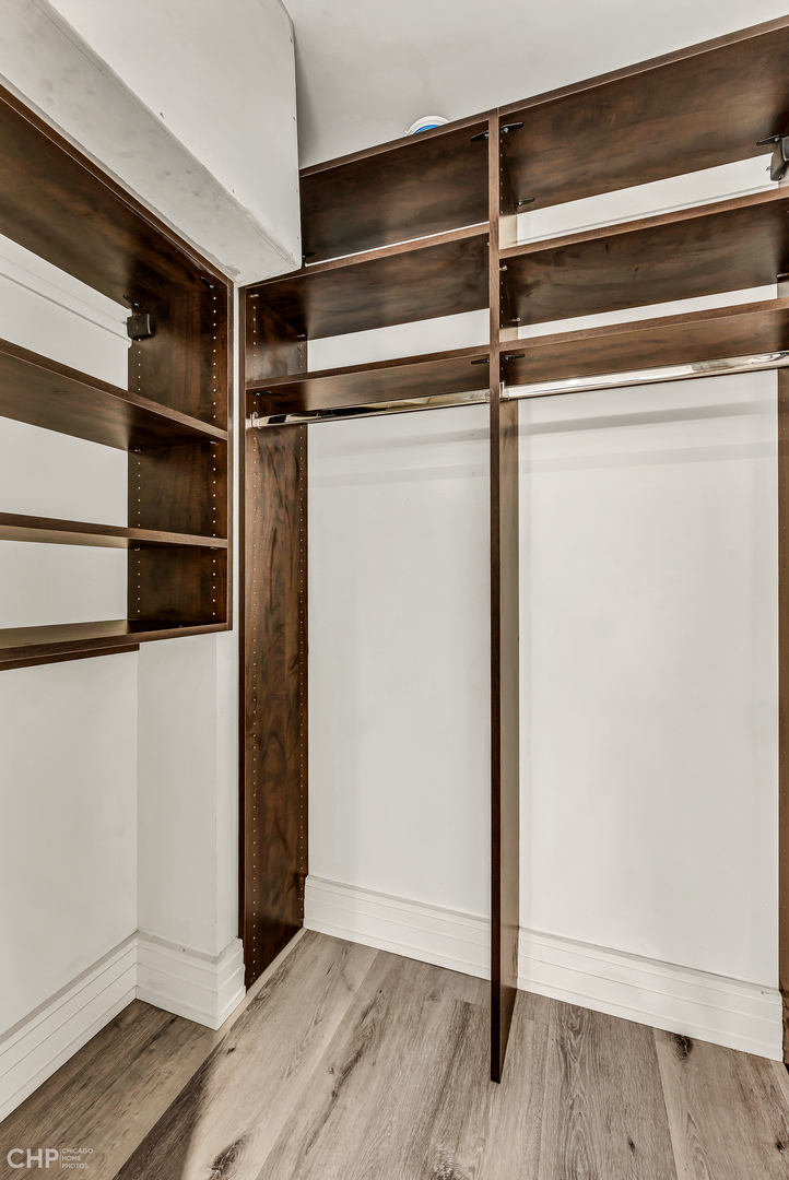 21 West Goethe Street, Unit 10G Chicago, IL 60610 - Photo 30 of 39 a view of walk in closet with empty racks