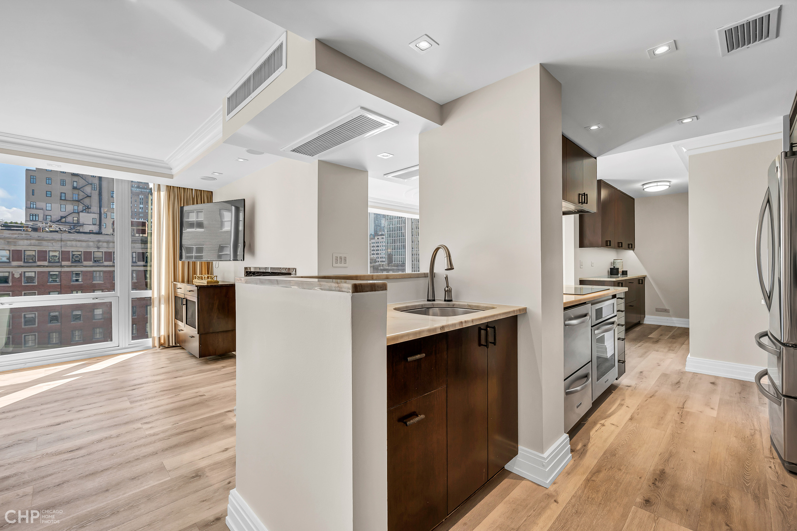21 West Goethe Street, Unit 10G Chicago, IL 60610 - Photo 6 of 39 a kitchen with a refrigerator and a sink