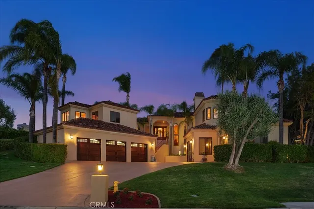 an aerial view of residential houses with outdoor space and river