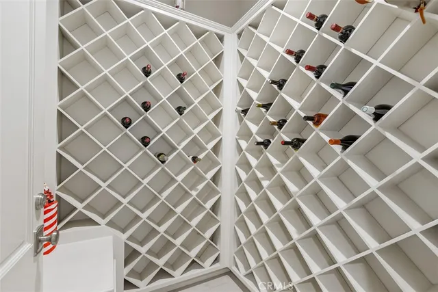 a view of walk in closet with clothes