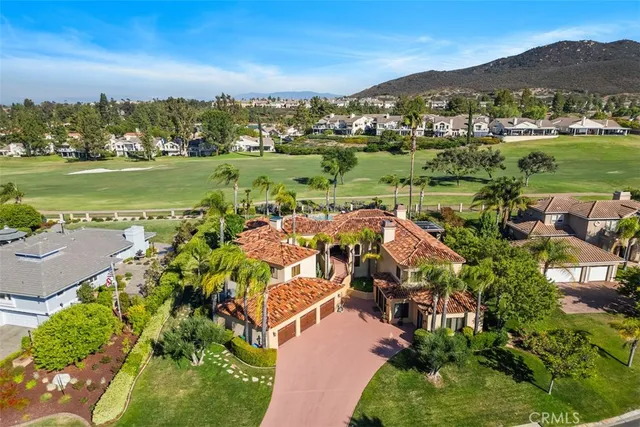 an aerial view of residential house and sandy dunes