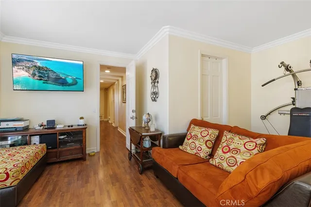 a swimming pool with outdoor seating and a garden