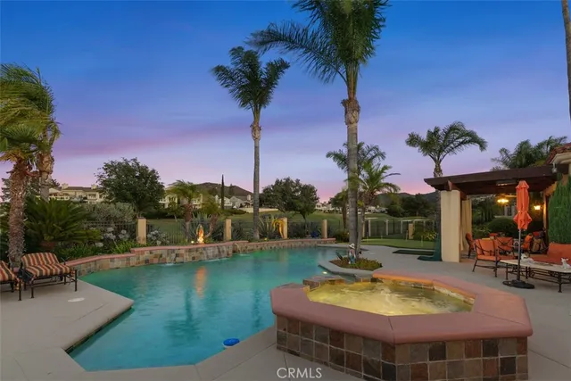 a view of a chairs and table on the deck and a patio