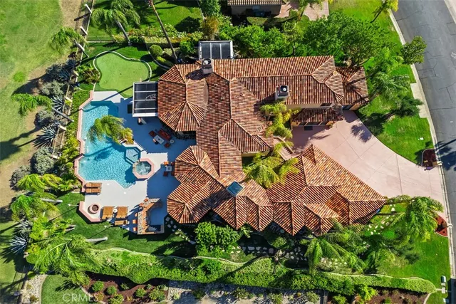 a aerial view of a house with a yard and garden
