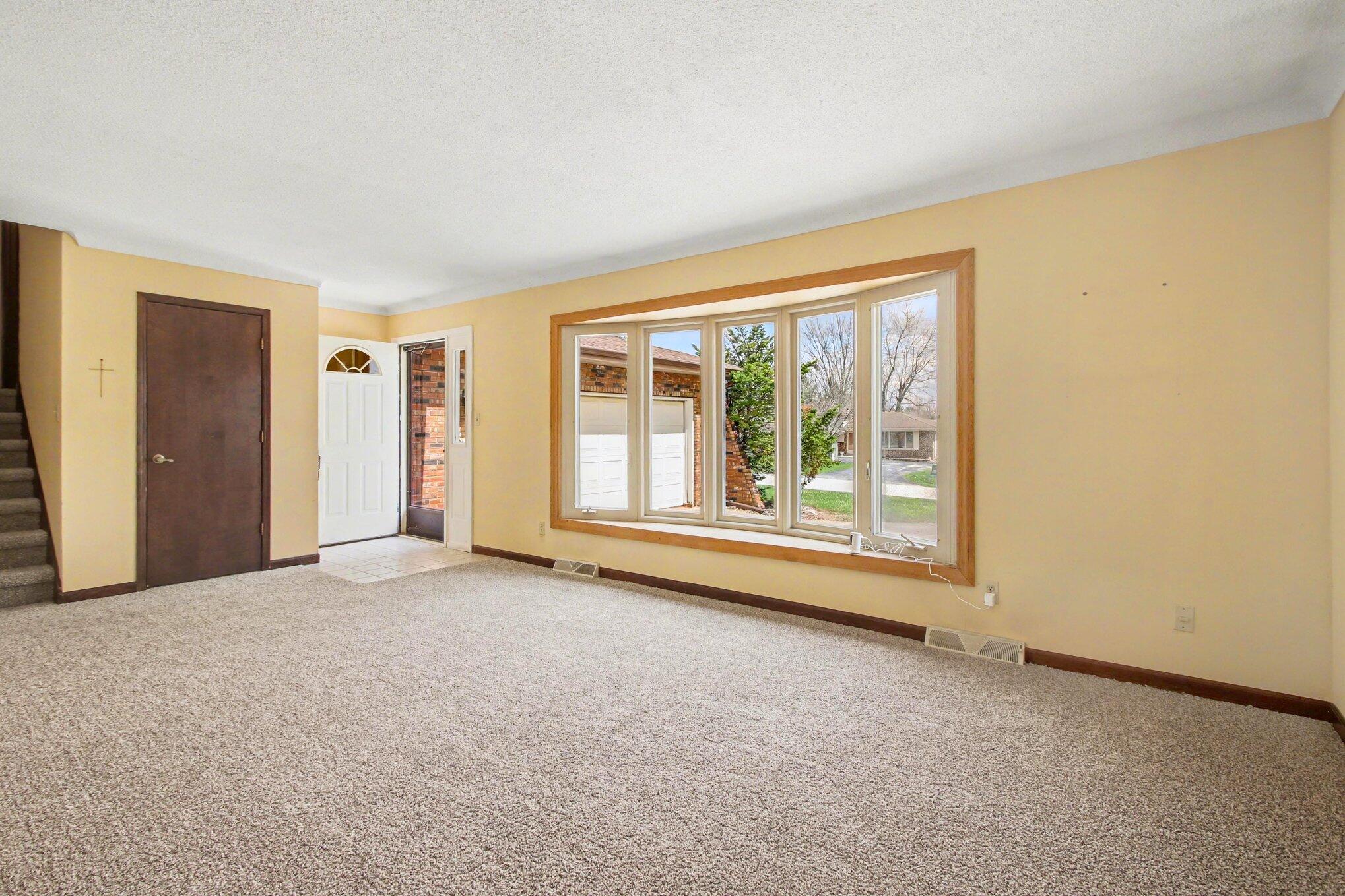 1379 Leeward Road Crown Point, IN 46307 - Photo 4 of 39 an empty room with front door