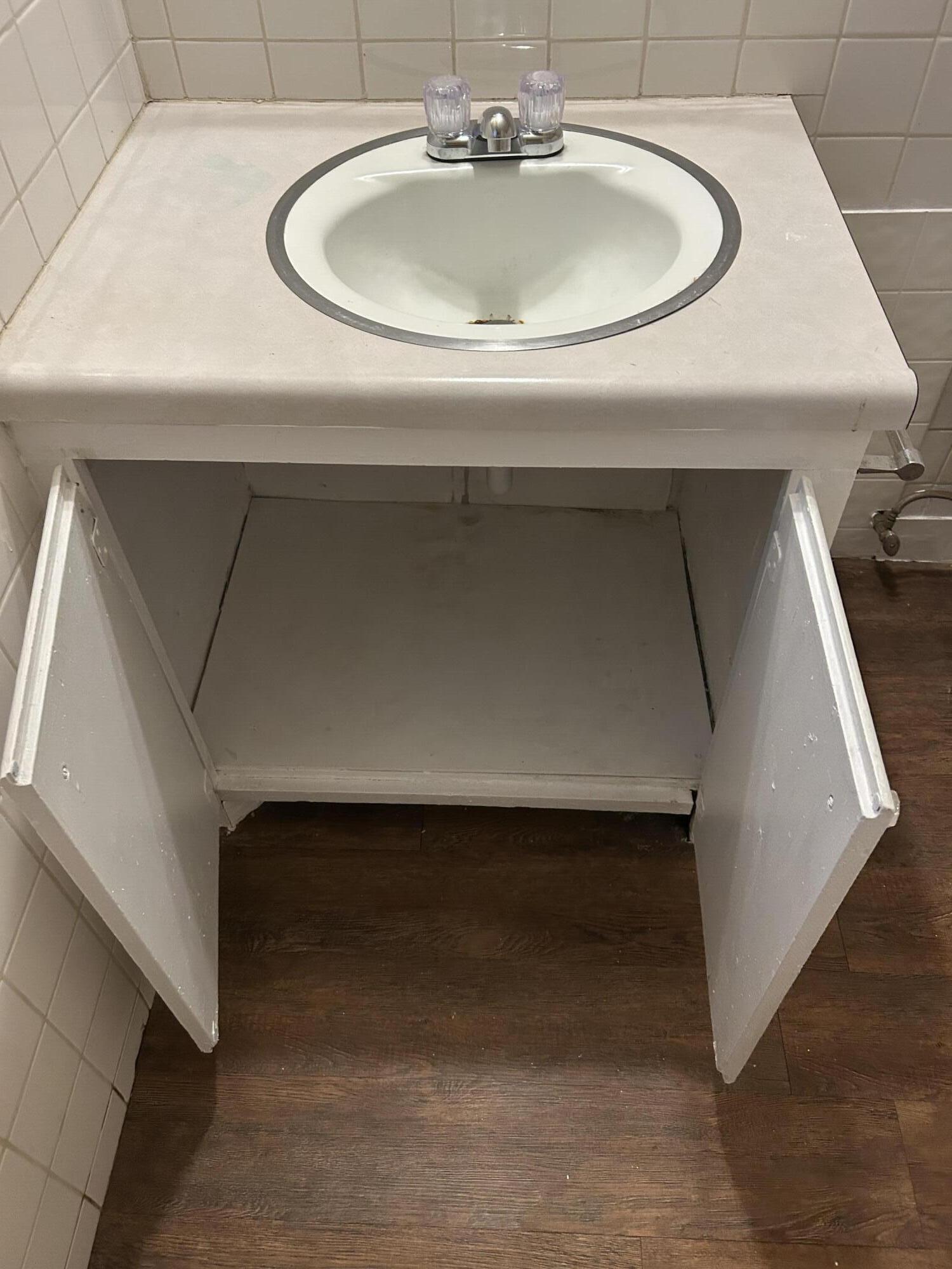 1102 42nd Street Lubbock, TX 79412 - Photo 14 of 16 a close view of sink and tap