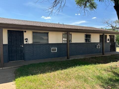 1102 42nd Street Lubbock, TX 79412 - Photo 2 of 16 a front view of a house with garden
