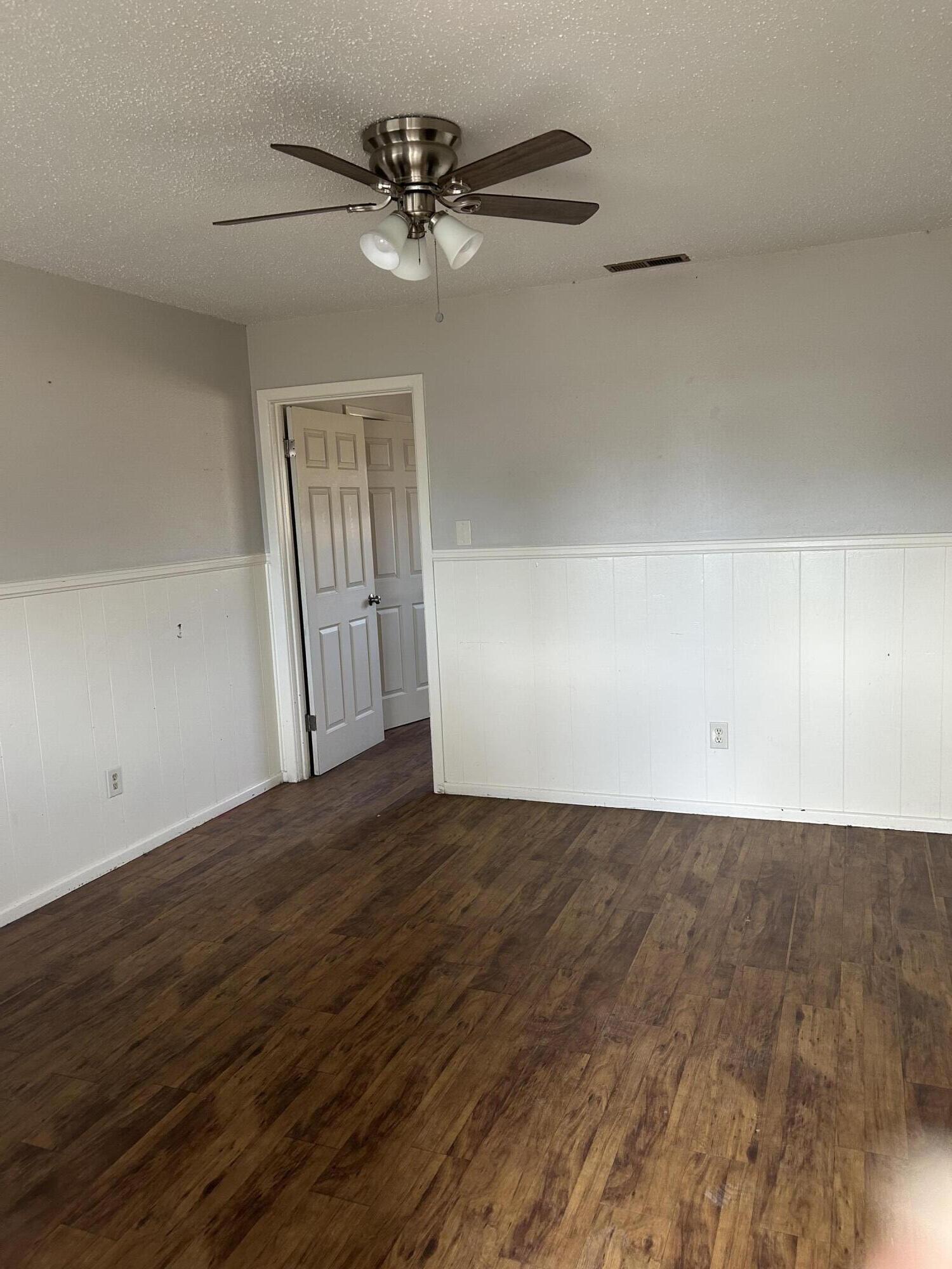 1102 42nd Street Lubbock, TX 79412 - Photo 5 of 16 wooden floor in an empty room