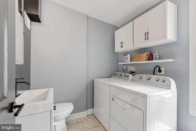 a view of backyard with a small cabin and a chair