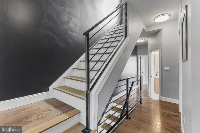 a view of a room with gym equipment and windows