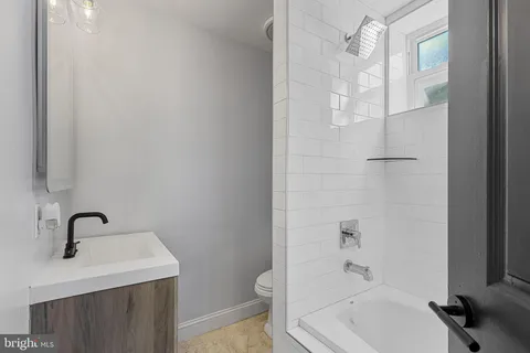 a view of a workspace with furniture and wooden floor