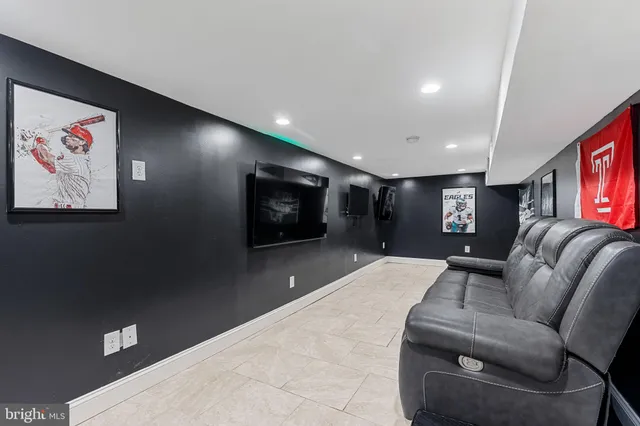 a living room with furniture a projector and a projector