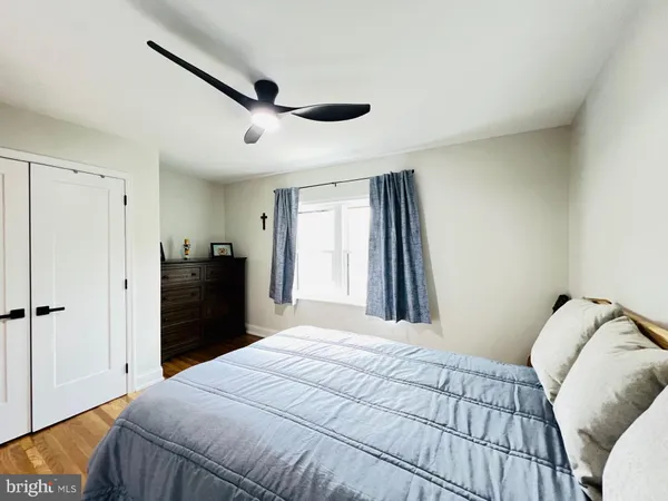 a view of walk in closet with clothes