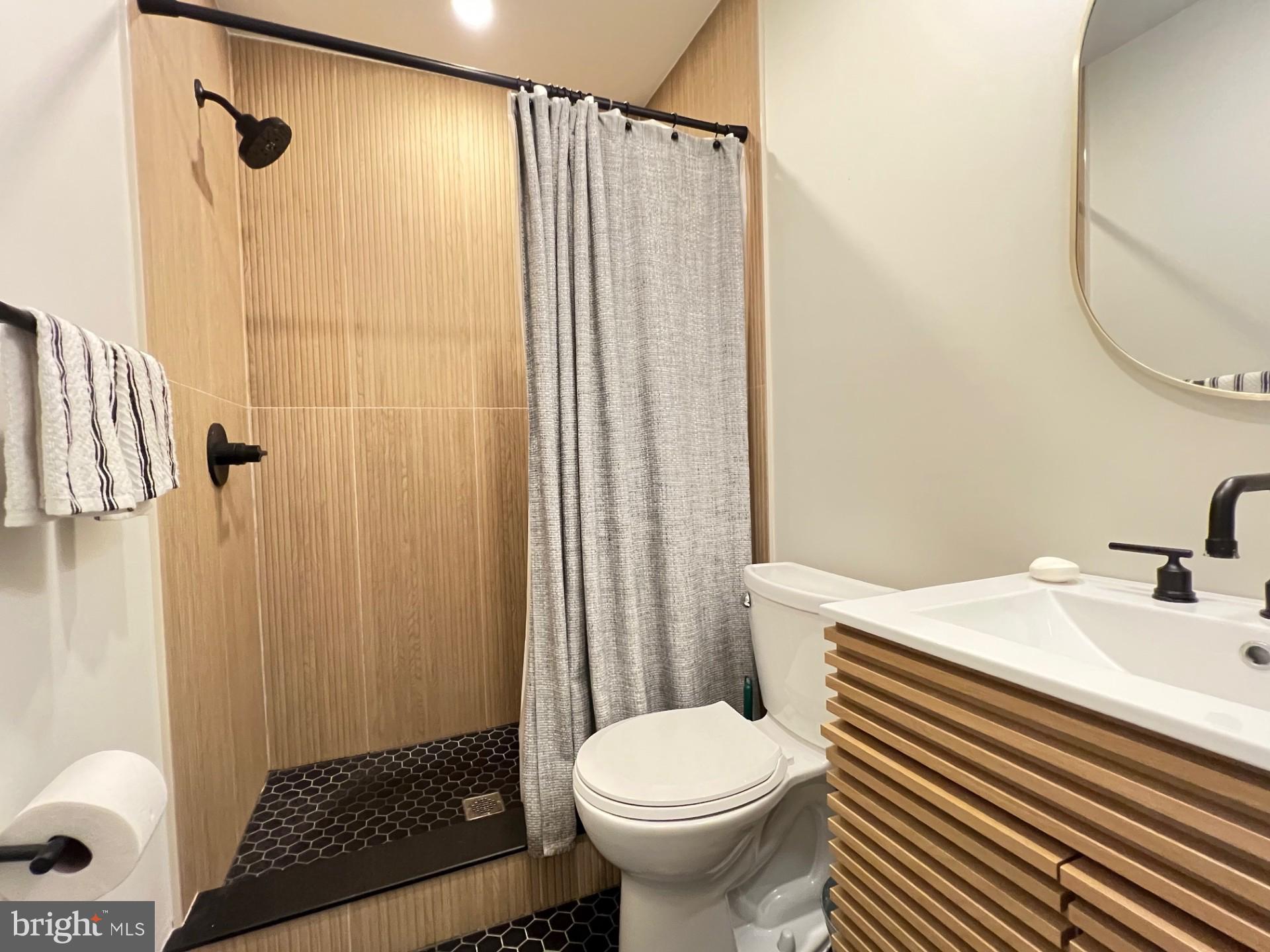 4735 Sheldon Street Philadelphia, PA 19127 - Photo 28 of 40 a bathroom with a sink and a mirror