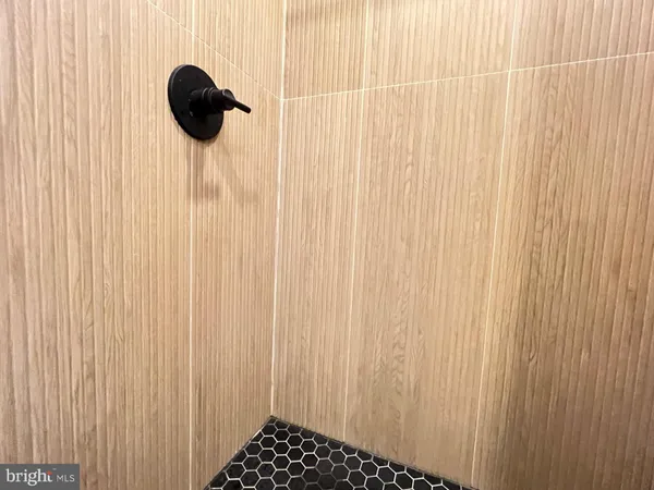 a view of a room with furniture and wooden floor