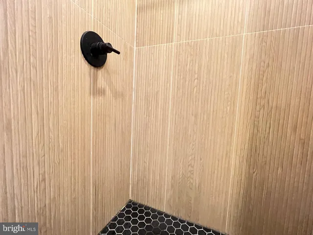 a view of a room with furniture and wooden floor