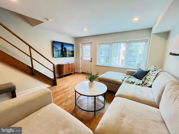 a living room with furniture and a large window
