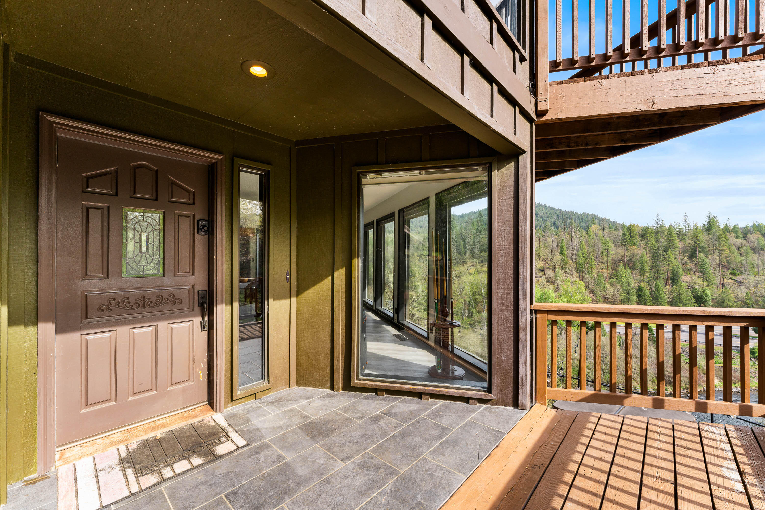 7201 Crowfoot Road Trail, OR 97541 - Photo 44 of 56 a view of a porch with wooden floor and a floor to ceiling window