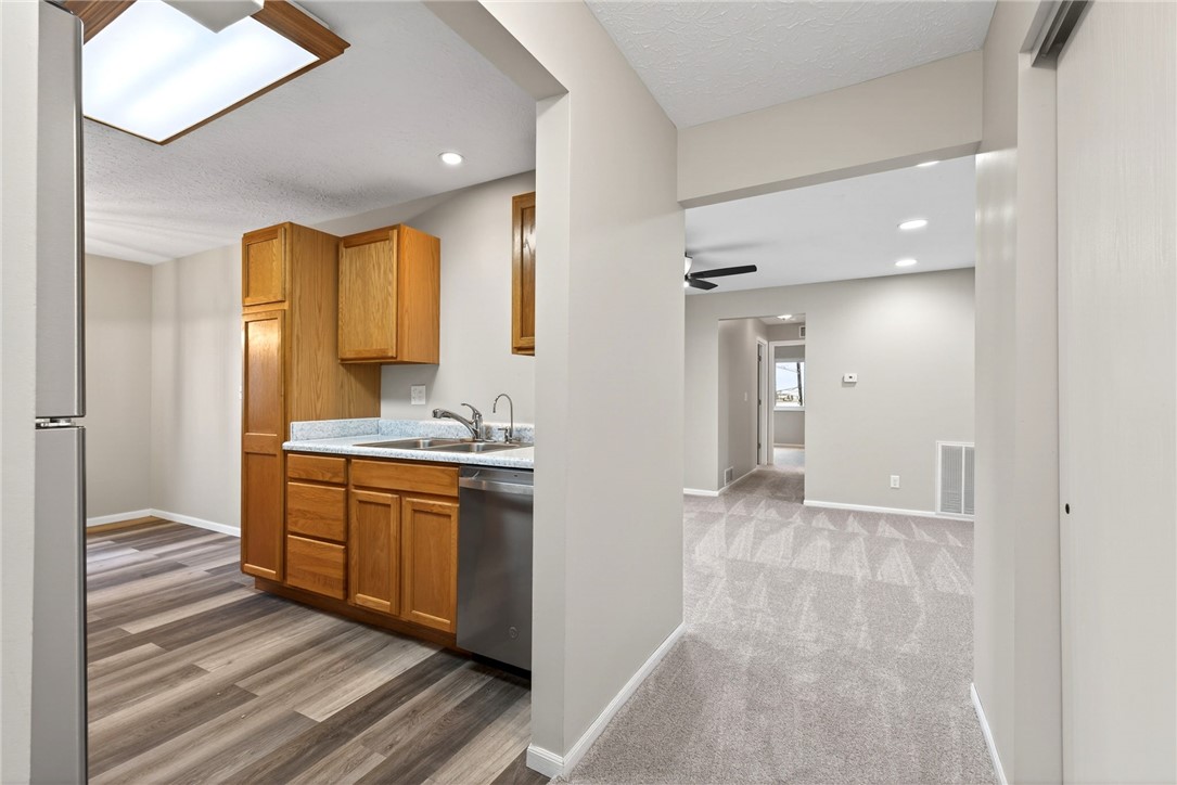 3151 Roesch Boulevard, Unit 6 Fairfield, OH 45014 - Photo 5 of 29 This modern kitchen seamlessly flows into a spacious living area, perfect for daily living.